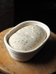 mix seed sourdough bread loaf proofing in basket