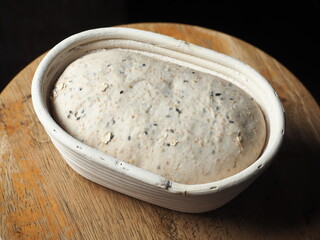 sourdough mix seed bread dough proofing in basket