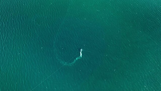 Aerial view parasailing in the summer season, Beautiful sea summer landscape,Waves sea water surface, High quality video Bird's eye view, Drone view ocean sea background