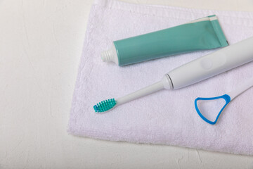 Toothbrush and tube of toothpaste on marble background with copy space. Flat lay. Oral hygiene. Oral Care Kit. Dentist concept. Place for text. Place to copy.