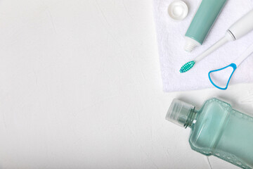 Bathroom with sonic electric toothbrush, toothpaste, mouthwash, dental floss and tongue cleaner . Oral hygiene. Dental care.Dentistry concept.Place for text.Place for copy.MOCKUP