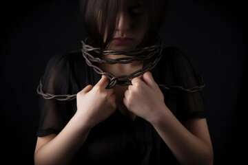 Portrait of a chained woman, human trafficking concept. Generative AI	
