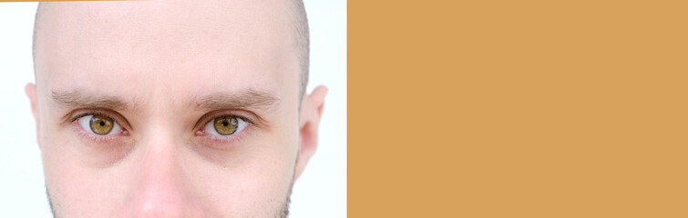 close-up of charismatic bearded young man 30 years old looking at camera, vision examination, face,...
