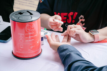 Fasting Blood Sugar , Hands of Pharmacist checking patient blood sugar by glucometer in drugstore