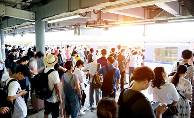 Many people waiting at train station