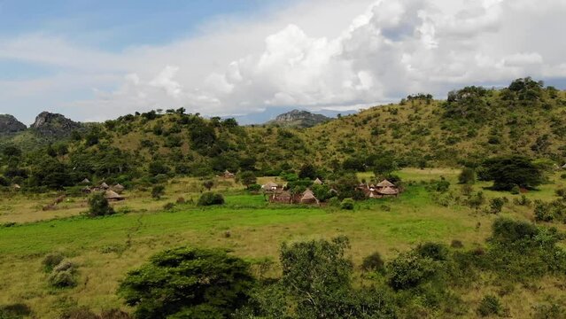 Aerial view of a typical african village called manyatta in the middle of the hills