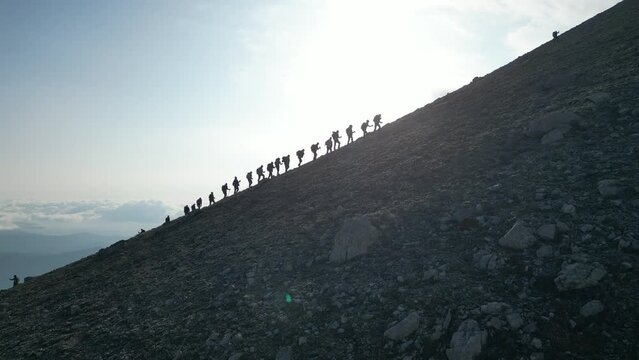 Hiking to the summit by association member mountaineers together