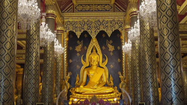 Golden big buddha statue named Phra Phuttha Chinnarat in Wat Phra Si Rattana Mahathat Woramahawihan