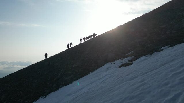 Hiking to the summit by association member mountaineers together