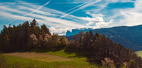 Alpine spring view with a church and Mount Schlern seen from Mount Ritten, Oberbozen, Bozen, Dolomites, South Tyrol, Italy