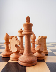 Set of wooden chessboard with chess pieces isolated on white background       © Mikhail
