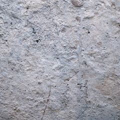 Old dirty cement wall with paint residues