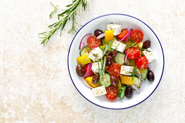 Greek salad. Vegetable salad with feta cheese, tomato, olives, cucumber, red onion and olive oil....