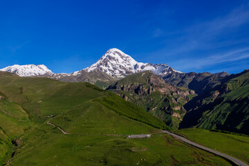 Fototapeta na wymiar Kazbek or Kazbegi mountain,near the Gergeti Trinity Church ,Stepantsminda village in Georgia ,At an altitude of 2170 meters, 