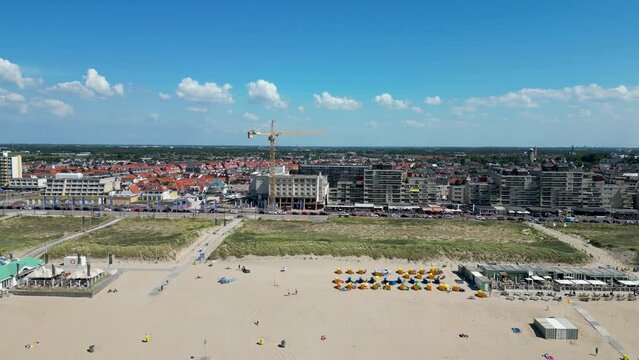 This aerial drone video shows the boulevard, the dunes, beach and north sea at Noordwijk aan Zee. Noordwijk is a famous place for tourists in the Netherlands.