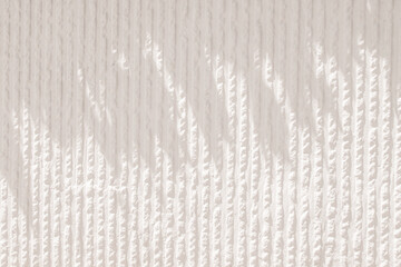 the white texture of a plaster or wall with small indentations.
