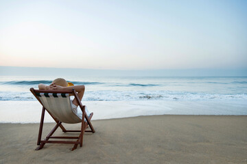 Young woman relaxing on the beach.