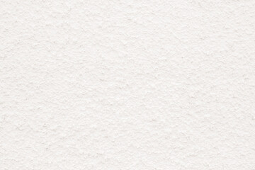 the texture of white plaster or a wall with small indentations.6