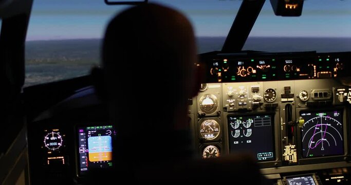 Back view of pilot taking off and flying an airplane at dusk. The pilot fixes the altitude level using the control panel instruments and navigation. Flight control concept. Airplane flight simulation.
