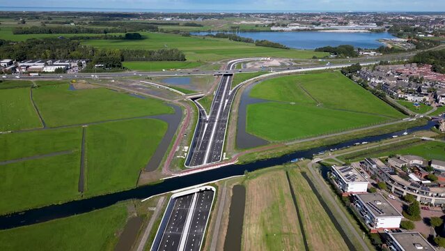 This aerial drone video shows an highway which is being build in the Netherlands. The highway connects the A4 with the A44 near Leiden.