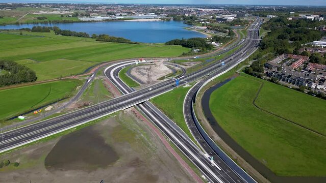 This aerial drone video shows an highway which is being build in the Netherlands. The highway connects the A4 with the A44 near Leiden.