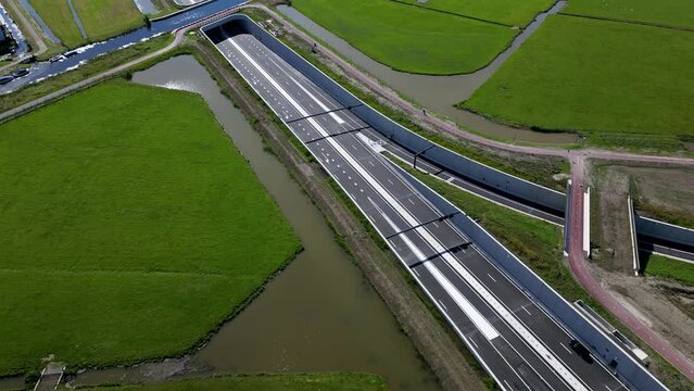 This aerial drone video shows an highway which is being build in the Netherlands. The highway connects the A4 with the A44 near Leiden.