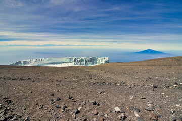 Rebmann glacier with backdrop of Mount Meru in the early morning light viewed from Kibo crater rim...