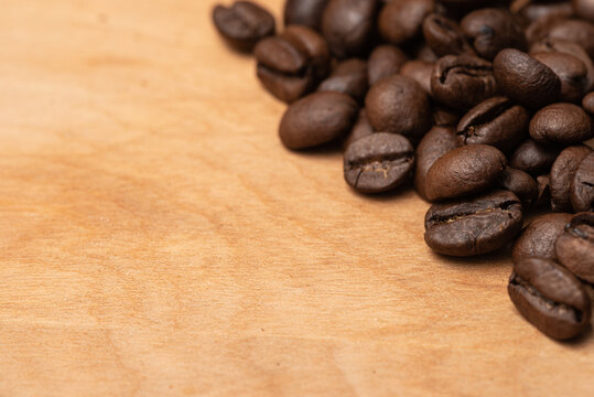 Coffee Beans on the side on a Wood Board