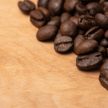 Coffee Beans on the side on a Wood Board