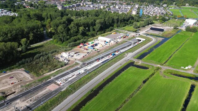 This aerial drone video shows an highway which is being build in the Netherlands. The highway connects the A4 with the A44 near Leiden.