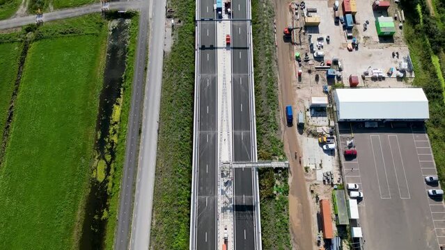 This aerial drone video shows an highway which is being build in the Netherlands. The highway connects the A4 with the A44 near Leiden.