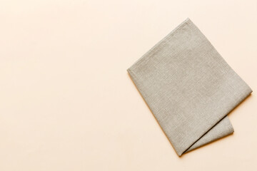 top view with gray kitchen napkin isolated on table background. Folded cloth for mockup with copy space, Flat lay. Minimal style