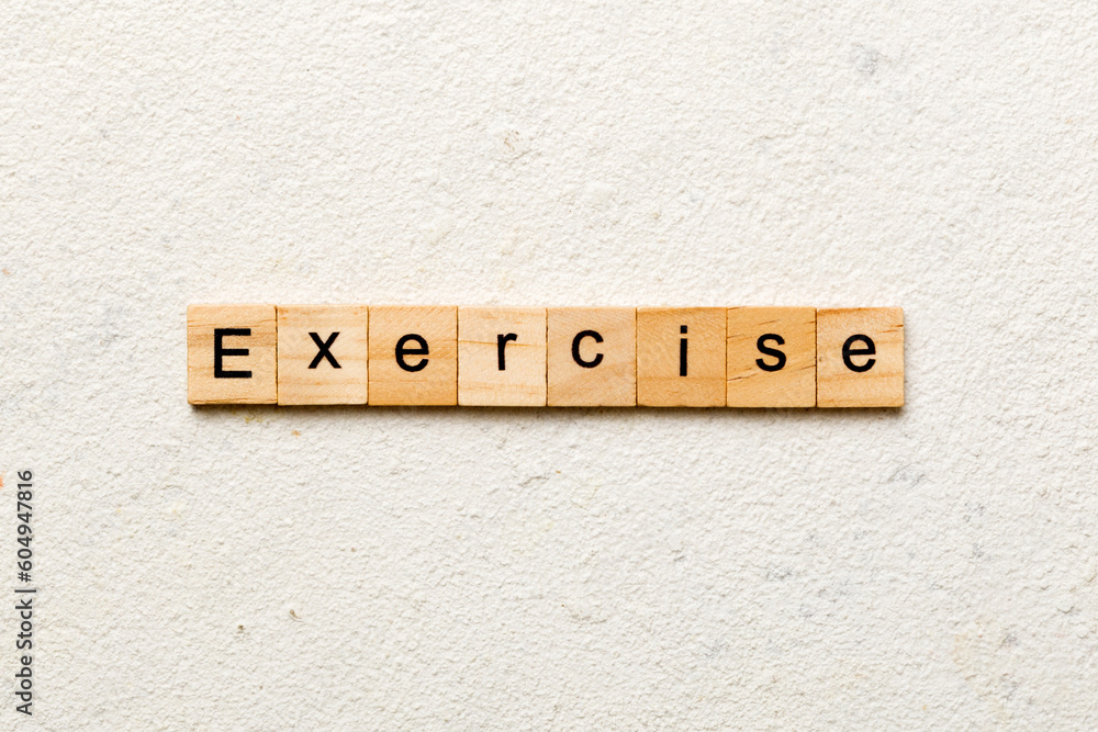 Fototapete exercise word written on wood block. exercise text on table, concept