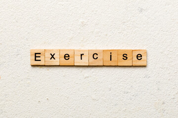 exercise word written on wood block. exercise text on table, concept