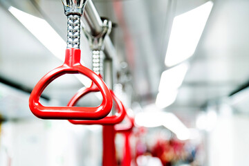 Red handles in the subway