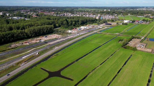 This aerial drone video shows an highway which is being build in the Netherlands. The highway connects the A4 with the A44 near Leiden.