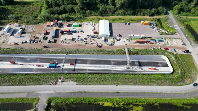 This aerial drone video shows an highway which is being build in the Netherlands. The highway connects the A4 with the A44 near Leiden.
