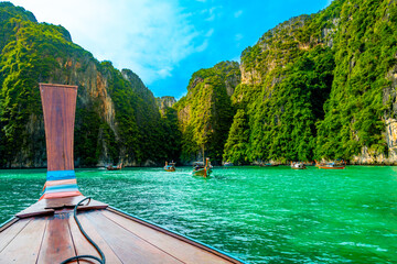 View of Pi Leh lagoon (also known as Green Lagoon) at Ko Phi Phi islands, Thailand. View from typical long tailed boat. Typical Thai picture of tropical paradise. Limestone rock and turquoise water.