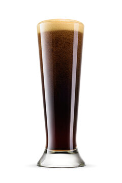 Pilsner glass of fresh dark stout beer with cap of foam isolated. Transparent PNG image.