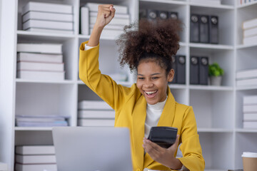 Excited african american woman sit at desk feel euphoric win online lottery, happy black woman overjoyed get mail at tablet being promoted at work, biracial girl amazed read good news at computer - obrazy, fototapety, plakaty