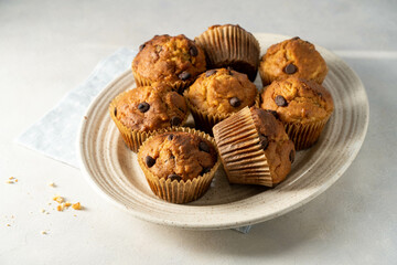 Chocolate chip muffins in a plate, home made pastry dessert