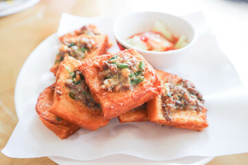 fried bread with minced pork spread, deep fried bread with pork topping