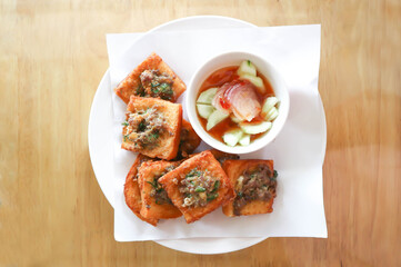 fried bread with minced pork spread, deep fried bread with pork topping