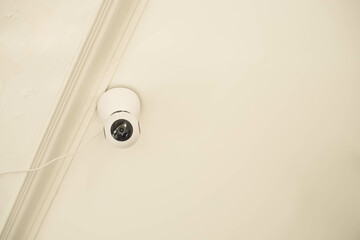 Modern Security CCTV at ceiling in building. Intelligent cameras can record video both day and night. Indoor surveillance camera with empty blank text copy space. Concept for anti-theft system.