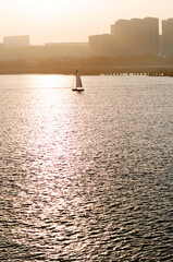 Sailboat in the sea at sunset