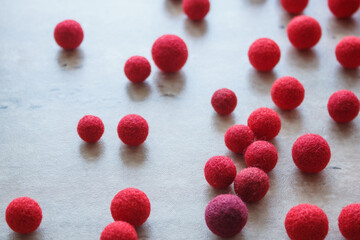 Red wool balls for needlework.