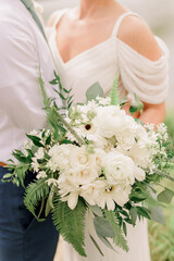 Bride in wedding dress holding a bouquet