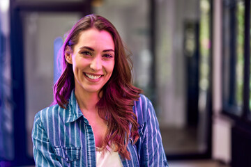 Portrait of a pretty businesswoman satisfied with her new job at the office.