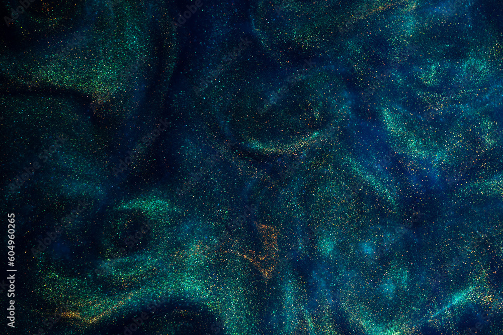 Canvas Prints bursting gold dust particles in blue liquid. abstract gold sparkling particles in blue fluid with gr