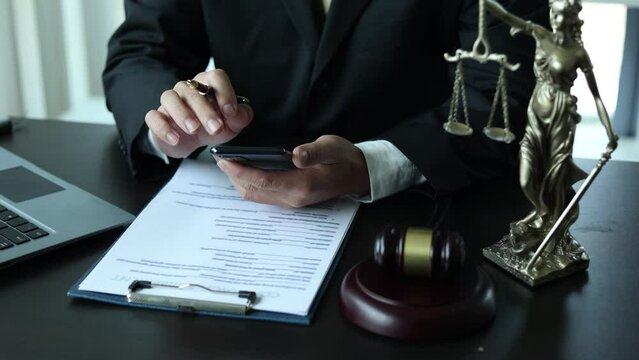 Court of Justice and Judicial: Male Lawyer Writes Argument for Defense Strategy Attorney lawyer fights for client freedom with supporting evidence. Close up.